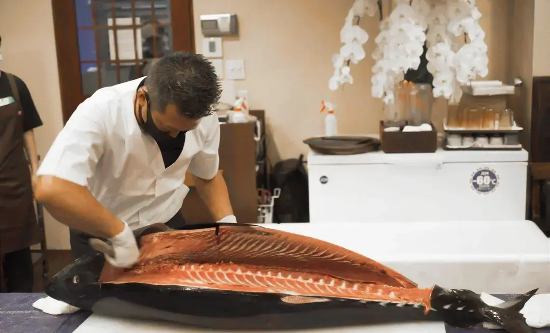 tuna fish being cut