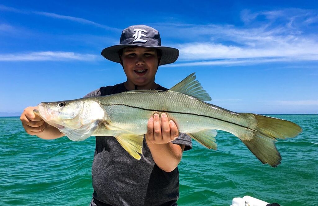 snook fish in hand