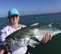 fisherman holding a large false albacore