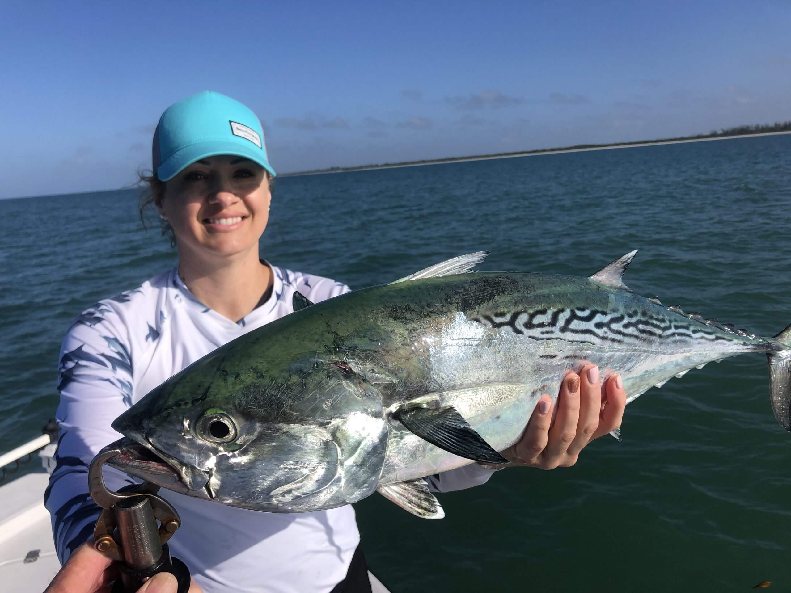 fisherman holding a large false albacore