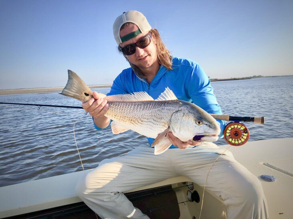 redfish catch in fishermans hand